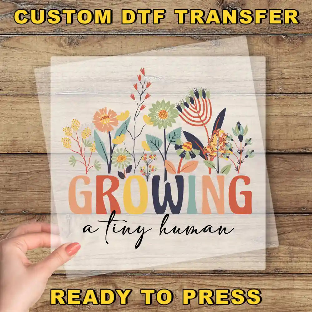 a person holding a piece of paper with the words growing on it