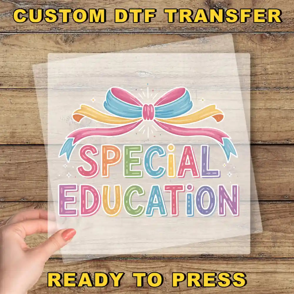 The image is a promotional poster for a custom DTF (Digital Transfer Factory) transfer service for special education. The poster features a hand holding a clear sheet with the text "SPECIAL EDUCATION" written on it, along with colorful ribbons and a bow. The text "CUSTOM DTF TRANSFER" is displayed at the top, and "READY TO PRESS" is at the bottom, indicating that the service is ready for use.