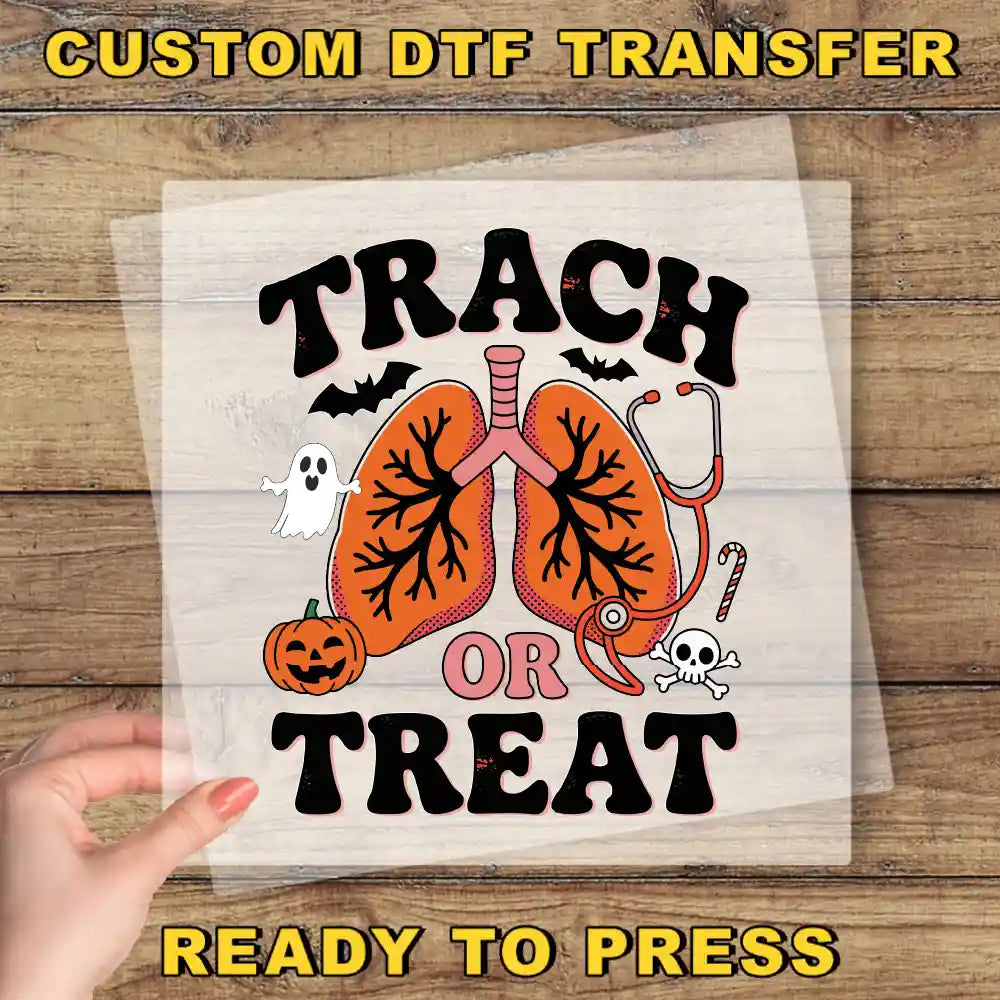 The image is a Halloween-themed graphic with a hand holding a clear sheet of the design. The design features a Halloween-themed lung with the text "TRACK OR TREAT" and various Halloween-related elements such as a ghost, a pumpkin, and a stethoscope.