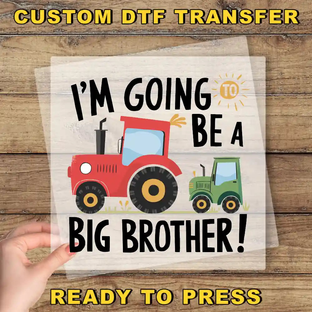 a hand holding a paper with a tractor on it