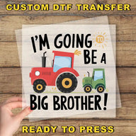 a hand holding a paper with a tractor on it