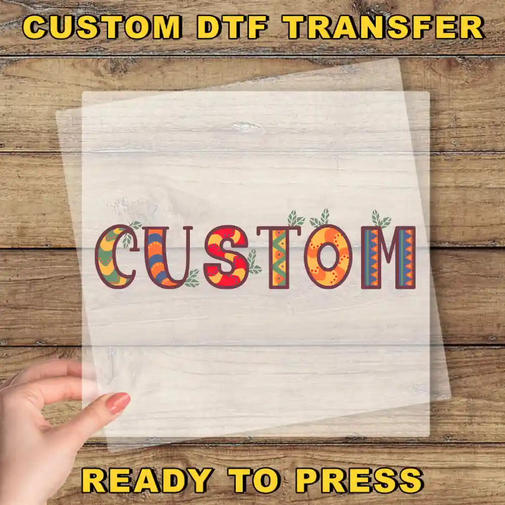 a hand holding a piece of paper with the word "CUSTOM" written on it, along with some colorful decorative elements.