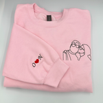 a pink shirt with a picture of a man and a woman on it